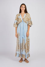 Women's blue and gold floral maxi dress with tassel detail and empire waist