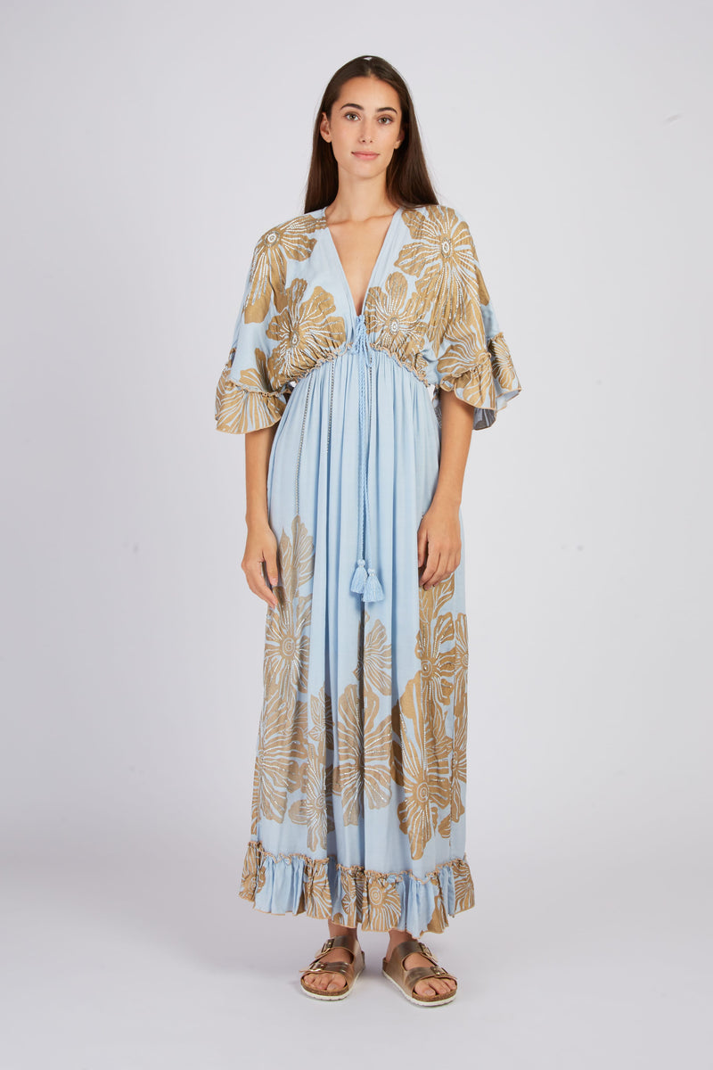 Women's blue and gold floral maxi dress with tassel detail and empire waist