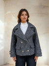 Close-up front view of wool-blend grey peacoat with structured collar.