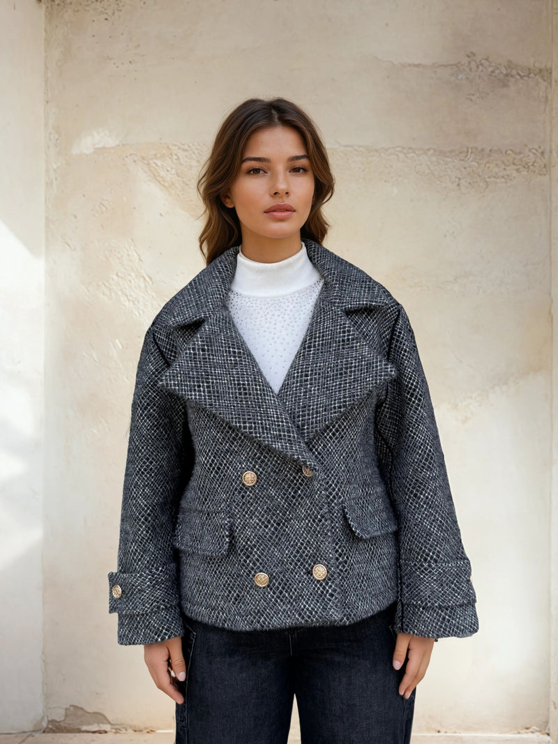 Close-up front view of wool-blend grey peacoat with structured collar.