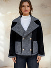 Front view of reversible-style jacket with contrasting black and grey textures.
