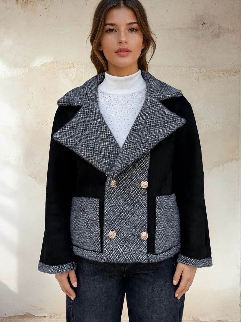 Front view of reversible-style jacket with contrasting black and grey textures.