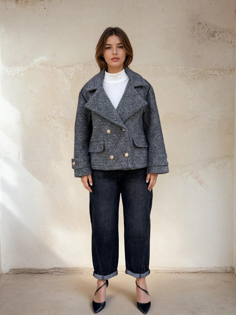 Full front view of grey peacoat styled with dark cuffed jeans and black pointed heels.