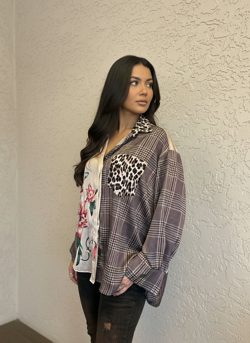 Side view of a model in a brown plaid floral blouse with leopard print pocket, styled with distressed dark jeans, showing the shirt’s relaxed fit and mixed-pattern design.