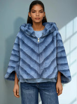 Front view of model in plush striped blue faux fur jacket with hood and zipper — modern cold-weather fashion